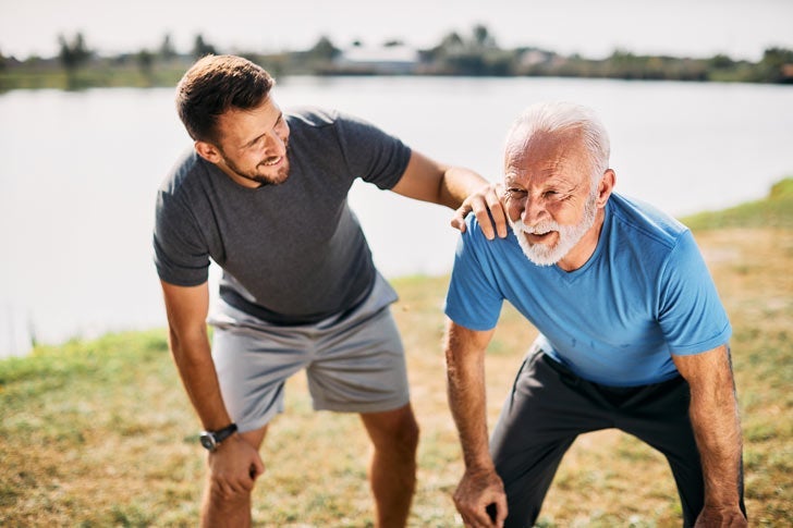 Father and son resting while on a run